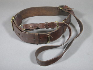 A brown leather Sam Browne army belt and shoulder strap