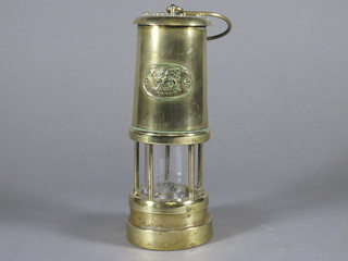 A brass miner's safety lamp