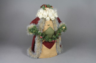 A standing figure of Father Christmas with celluloid face 16"