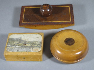 A pair of turned wooden campaign candlesticks 4 1/2", a wooden parquetry blotter and a box decorated The Grand Parade  Eastbourne
