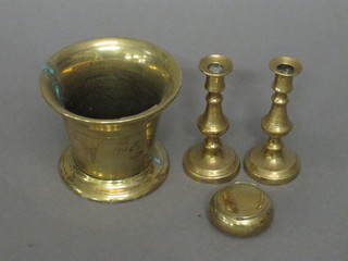 A brass mortar 3 1/2", a pair of brass taper sticks 4 1/2 and a circular snuff box