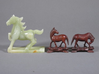 A pair of Oriental carved wooden figures of horses 3" and an  onyx figure of a horse