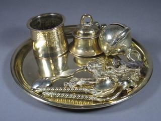 A circular brass tray, a miniature brass figure of a standing bear,  2 bells, 3 brass monkeys and other curios
