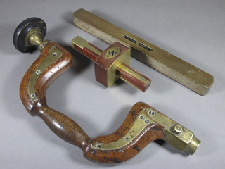 A carpenter's brass and mahogany brace and bit, a mortice gauge and a spirit level by J Rabone & Sons  ILLUSTRATED