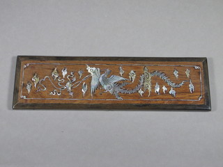 A 19th Century rectangular rosewood panel inlaid mother of pearl decorated a mythical beast 2" x 8"