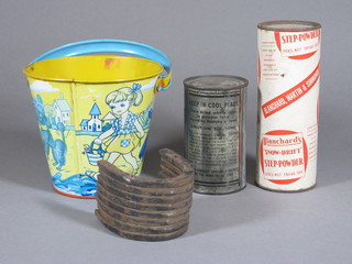 A tin of American Pure Whole Dry Egg, tin of Blanchard Martin  & Simmons Step Powder, 8 iron pony shoes and a child's pressed  metal bucket