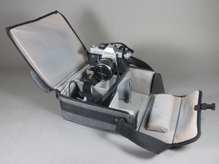 A Canon FTb camera fitted a Canon lens FD35MM 1:2 complete with carrying case