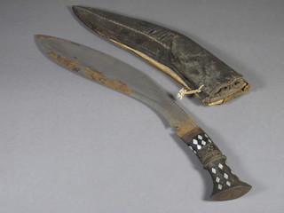 A Kukri with 12" blade and leather scabbard
