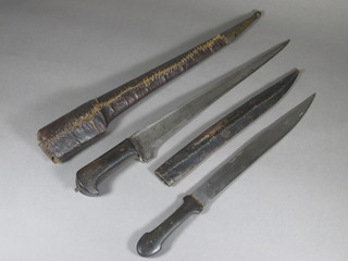 A Kard dagger with 16" blade and leather scabbard and 1 other dagger with 13" etched blade, horn grip and leather scabbard