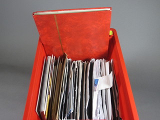 A red stock book of GB stamps, a collection of GB stamps  and various first day covers contained in a red crate