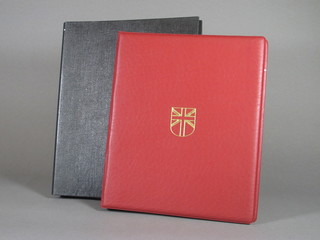A loose leaf album of GB stamps and a red loose leaf album of  GB stamps