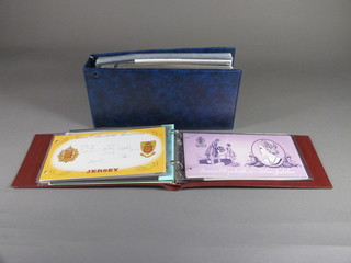 A blue album of first day covers and presentation stamps and an  album of Jersey first day covers