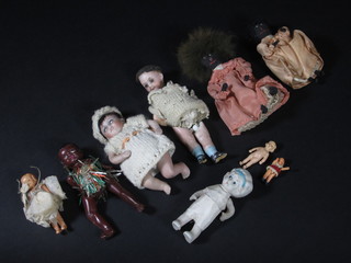 9 various miniature dolls