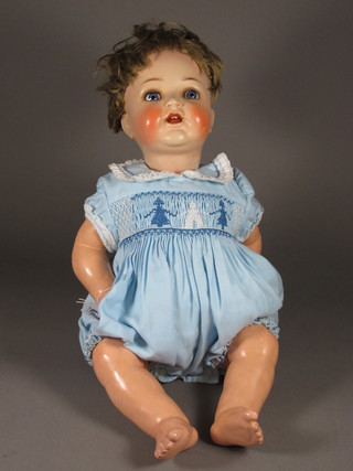 A Franz Smitt porcelain headed doll with open and shutting eyes,  open mouth with 2 teeth, the head incised 1269, 22"