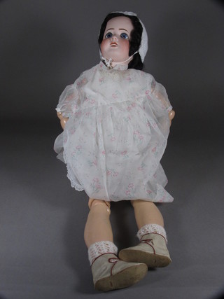 A Limoges doll with open eyes, open mouth with teeth and  articulated limbs 27"