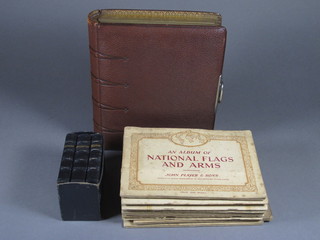 A leather bound family photograph album and 9 various Players cigarette card albums and 3 leather bound hymn prayers and  lesson books