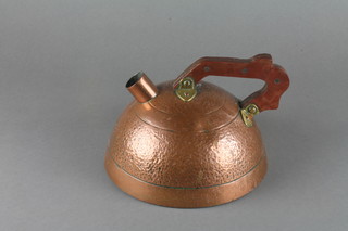 A circular planished copper kettle, whistle missing,