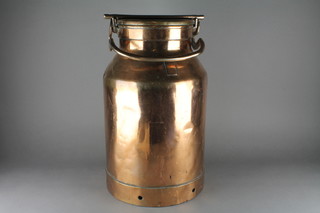 A circular copper milk churn