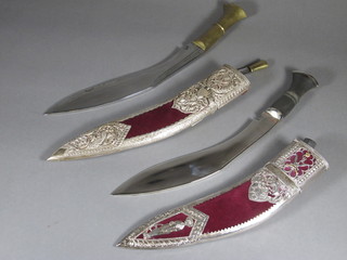 A pair of presentation Kukris with 11" blades contained in plush  and "silver" mounted scabbards decorated the cap badge of the  Gurkha Signals