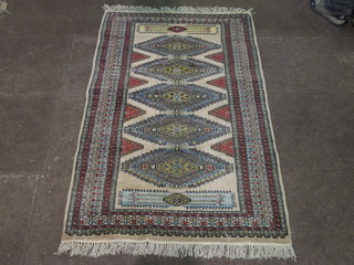 A contemporary cream ground Bokhara with 5 stylised diamonds  to the centre within multi-row borders 62" x 36"