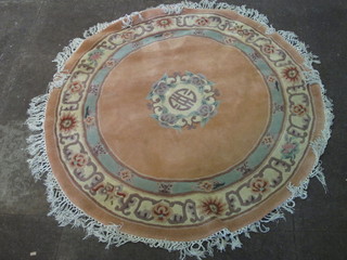 A circular rust ground Chinese rug 59"