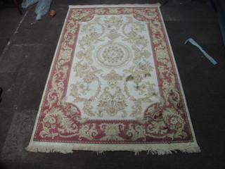A gold coloured Aubusson style cotton rug 89" x 58"