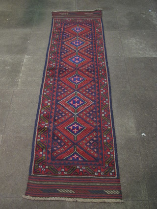 A Persian Sumak red ground runner with 6 1/2 octagons to the  centre 98" x 23"