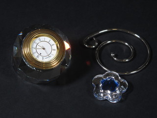 A Swarovski table clock and a hanging pendant