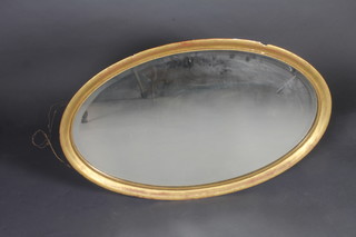 A bevelled plate wall mirror contained in a decorative gilt frame 32"