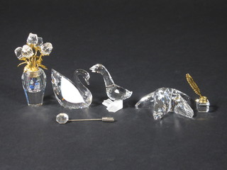 A Swarovski figure of a star fish 2", do. vase of flowers 2", do.  swan 1", do. Goose 2", miniature inkwell and a Swarovski stand