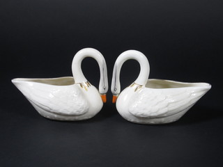 A pair of Beleek sauce boats in the form of swans, the bases with green mark 5"