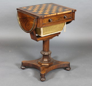 A handsome Regency rosewood drop flap games/work table, the lid inlaid a chessboard, the interior inlaid a cribbage board, the  drop flaps with brass three-quarter gallery, raised on a chamfered  column with triform base 19"