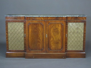 A Georgian style mahogany breakfront sideboard with green veined marble top, the centre section fitted cupboards enclosed by  panelled doors and flanked by a pair of cupboards enclosed by  grilled doors, 65 1/2"