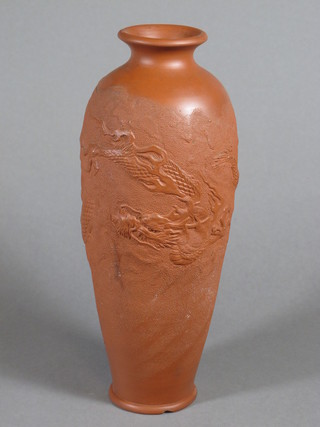 An Oriental terracotta vase decorated a dragon, the base with 2 character mark 12", chip to base,