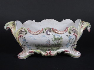 A Quimper style twin handled boat shaped planter with panel decoration raised on boat shaped feet 16"