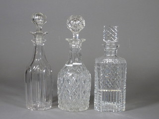 A cut glass spirit decanter and stopper and 2 club shaped  decanters