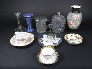 A pair of octagonal black glazed vases with floral decoration, f, a pair of glass candlesticks, a glass biscuit barrel and cover, a cut  glass vase, a part Royal Albert Derby style tea service, a pair  floral patterned tea service, a Noritake coffee service and other   decorative ceramics