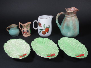 An Empireware green glazed jug 8", a Royal Worcester Evesham  Gold jug 6", 2 other jugs and 3 Carltonware leaf shaped dishes