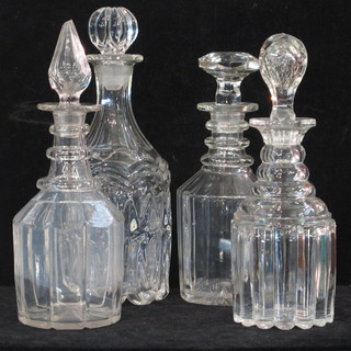 A Georgian ring neck and panel cut decanter and stopper and 3  other decanters