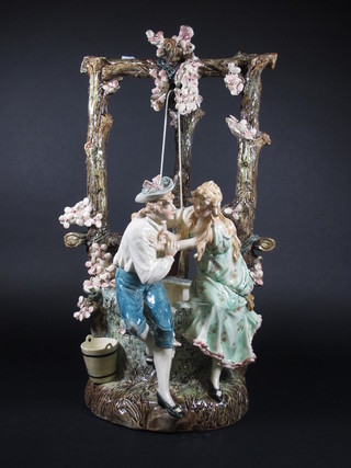 A Continental porcelain vase in the form of a well head with 2  seated figures 24", cracked,