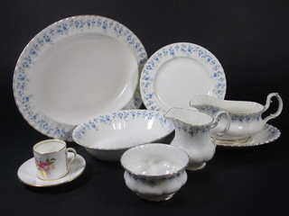 An 86 piece Royal Albert Memory Lane patterned dinner service comprising oval sauce boat and 2 stands, 2 oval meat plates 16"  and 13 1/2", 13 dinner plates 10 1/2" - 2 slight chips to base, 12  side plates 8", 13 tea plates 6 1/2" - 2 cracked, 4 oval bowls 9",  11 bowls 6 1/2" - 1 chipped, cream jug and stand, 2 twin handled  plates 9 1/2", sugar bowl 4", 14 cups - 1 chipped to base, 13  saucers, a circular cake stand top 6" together with a 12 piece  Aynsley coffee service decorated roses - 6 cups - 1 f and r and 6  saucers