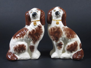 A pair of Staffordshire figures of seated dogs 8"