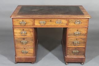 A Victorian walnut desk with inset writing surface above 1 long and 8 short drawers with brass swan neck drop handles 40"