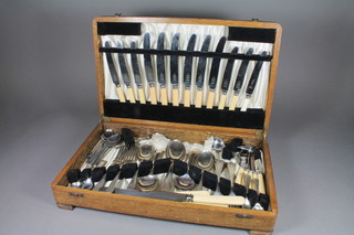 A canteen of silver plated Old English flatware contained in an oak canteen box