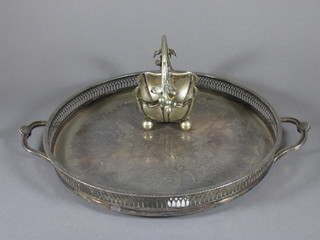 A square silver plated basket raised on bun feet 4" and a circular engraved and pierced silver plated twin handled tea tray 13 1/2"