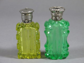 2 green and yellow cut glass perfume bottles with embossed  white metal tops, 3 1/2"