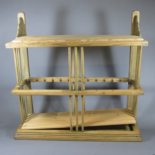 A 19th Century stripped pine hanging plate rack 28"