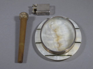 An Art Deco onyx and silver mounted oval ashtray 6 1/2",  London 1913, a Dunhill silver plated lighter and a gilt metal and  horn mounted parasol terminal