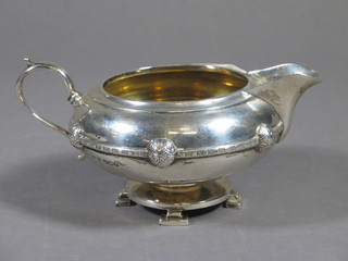 A circular silver Celtic style cream jug, Sheffield 1934, 6 1/2 ozs