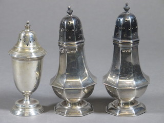 A pair of Victorian silver pepper pots, London 1897 and 1 other, 5 ozs